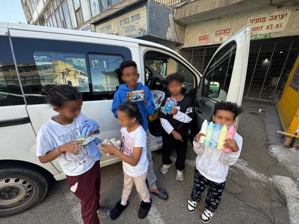 Children receiving gifts from the ministry
