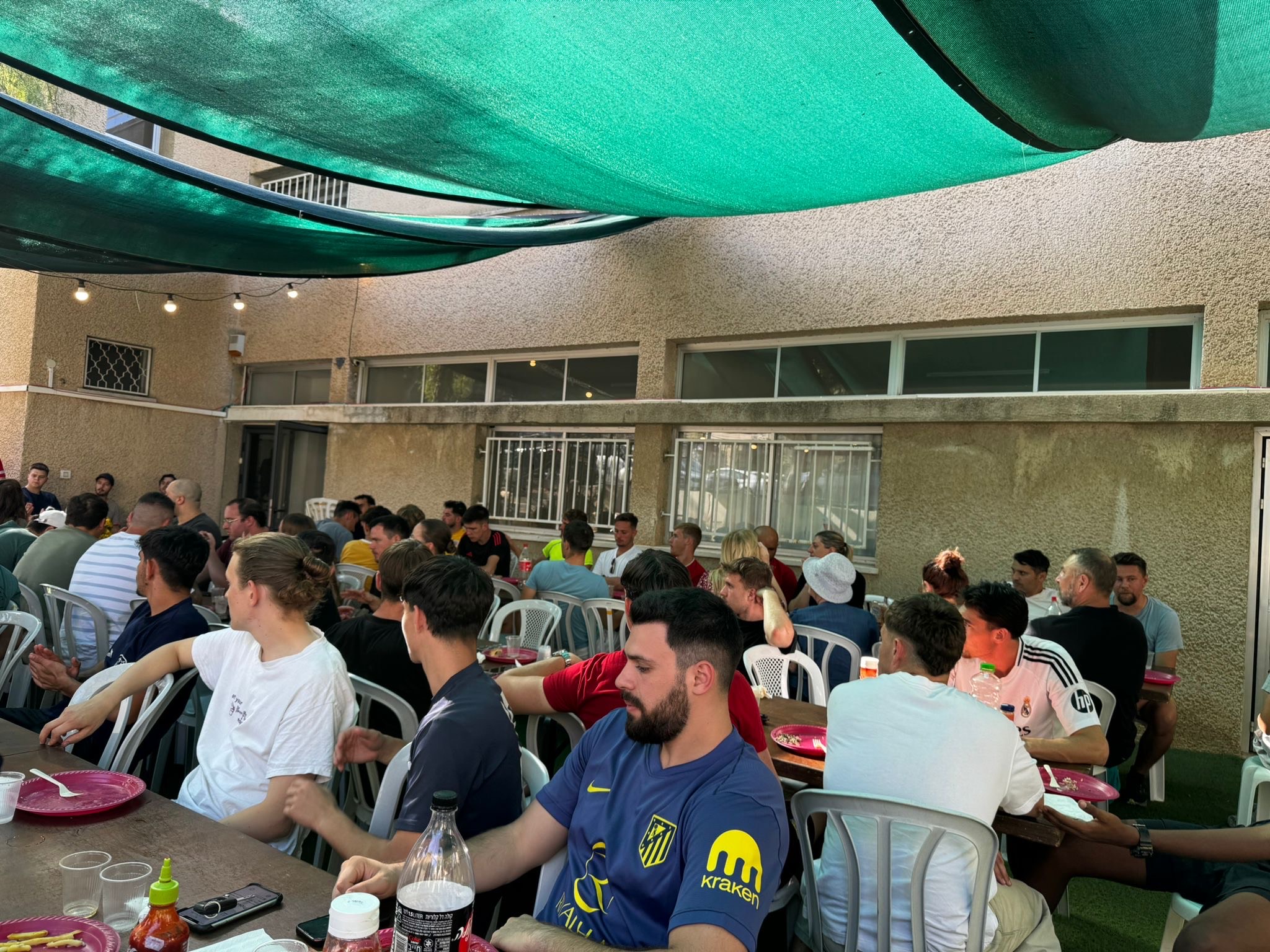 Large group sharing a meal together at tournament