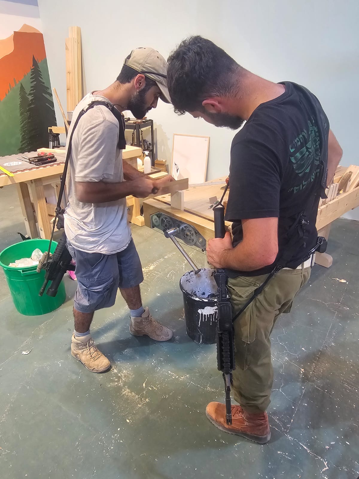 Soldiers painting woodwork together