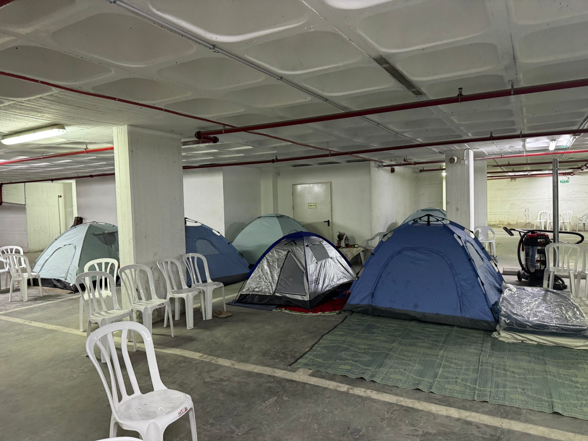 Tent set up inside a shelter space